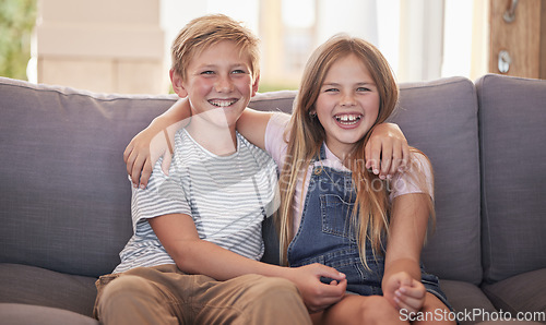 Image of Family, children and sister and brother relax on a sofa, happy and laughing in their home together. Portrait, kids and siblings bond in a living room, sharing joke and close relationship in Amsterdam