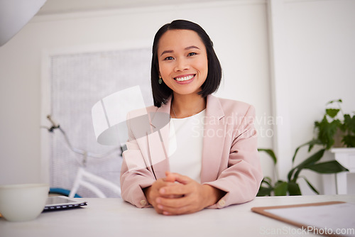 Image of Business woman, asian and boss or ceo of a company at office desk with a smile and pride for career choice and achievement. Portrait of a female entrepreneur and leader happy about startup success
