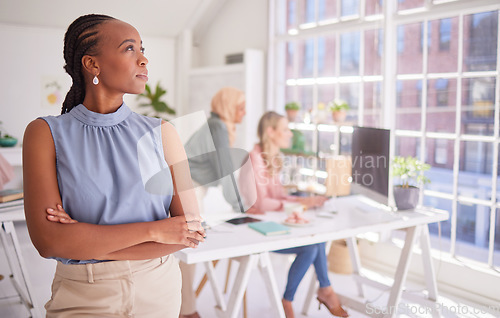 Image of Black woman, leadership and vision with arms crossed for corporate strategy, planning or ambition for improvement. African female employee manager thinking with aspiration for career growth at office