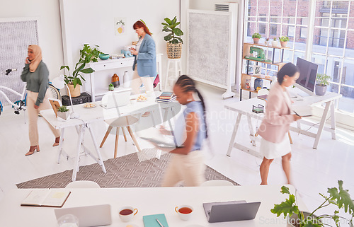 Image of Office diversity, walking and busy women working on woman empowerment advertising research in marketing agency. Coworking group, startup small business and fast moving team planning campaign schedule