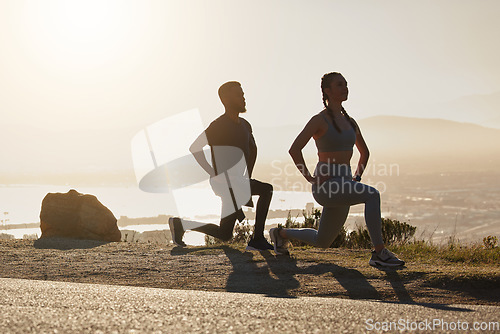 Image of Fitness, beach and couple doing a lunge exercise for health, wellness and training in nature. Motivation, sports and healthy man and woman athletes doing an outdoor workout by the ocean at sunset.