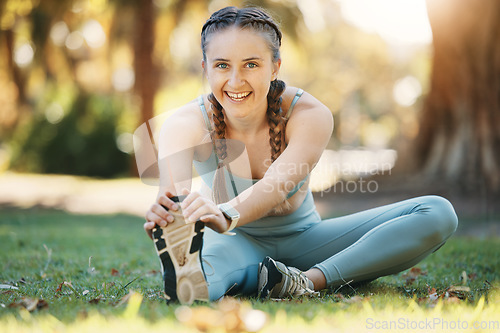 Image of Fitness, exercise and woman stretching on grass at a outdoor park during a workout for health and wellness. Portrait of a sports or athlete model in nature for cardio training, energy and mindfulness