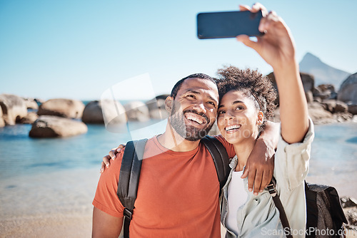 Image of Couple, love and phone selfie on beach for travel adventure or summer vacation. Happy man, woman smile and photography for holiday lifestyle on 5g smartphone for social media at ocean water outdoors