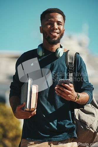 Image of Student, man and phone in the city for studying, education and knowlegde break. African american man, university or college student and online social media browsing or texting before class