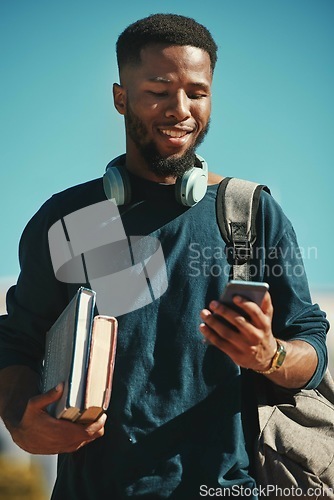Image of Social media, student and black man with a phone at a college for communication, contact and mobile app. Studying, smile and African education learning on a mobile with 5g internet at university