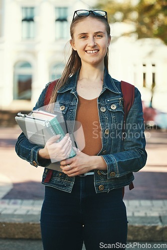 Image of Portrait, woman student or holding books with smile, ready for class or confident for studies. Course, young female or girl stand with novels, journals or happy for lesson, casual or outdoor to relax