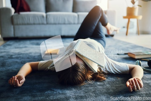 Image of Book, student and university burnout with girl and exhausted on living room carpet, education and study for exam. Lying on floor, tired and overworked with stress about college with notebook.