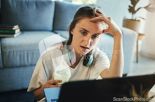 Image of Freelance, remote work and tired, woman feeling stress, depression or anxiety while on a laptop frustrated with glitch, error or internet. Stressed entrepreneur drinking milkshake while working