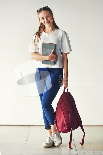 Image of Studying, books and student at a college for education, knowledge and scholarship with a smile. School, happy and portrait of a girl ready for university with backpack on campus for higher education