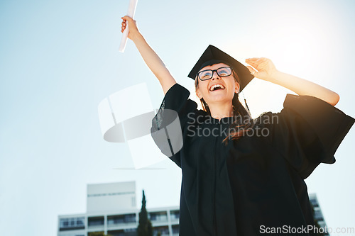 Image of Success, graduation and woman or student with certificate, degree or diploma low angle. Graduate, celebration and female scholar happy with academic achievement, university goals or education targets