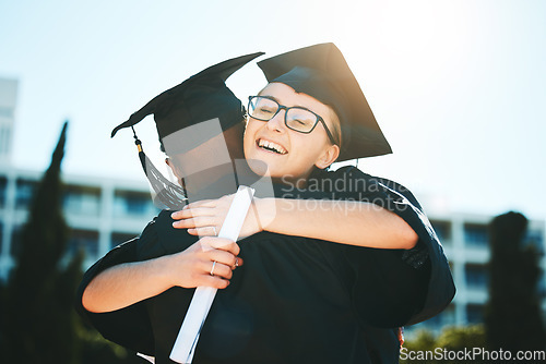 Image of Hug, graduation and students success for achievement, happy and smile outdoor in gown. Graduate, happiness or embrace for degree, certificate and education completed at university, college or diploma