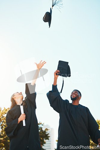 Image of University, graduation and students with graduation cap in air for celebration, happiness and joy. College, education and man and woman throw hats after achievement of degree, diploma and certificate