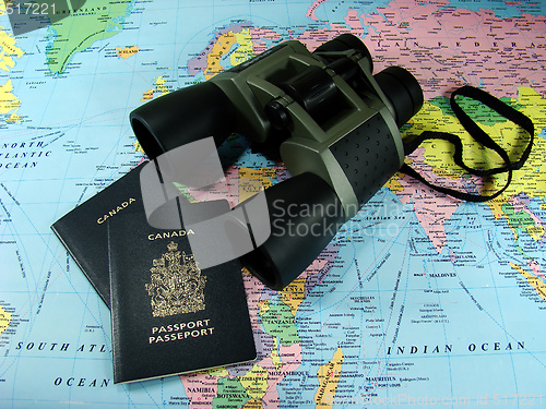 Image of Binoculars, map and travel passports