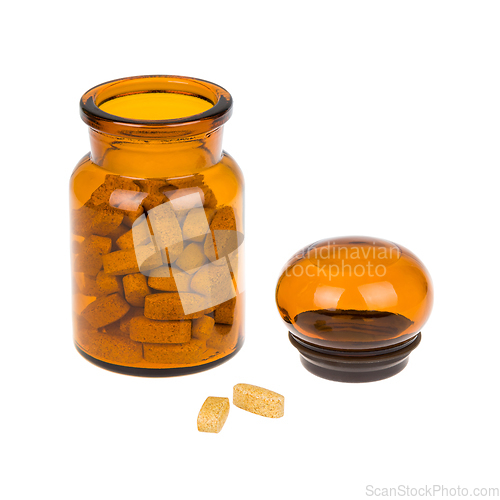 Image of Full vintage apothecary bottle with pills and closed lid