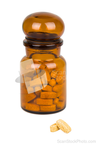 Image of Full vintage apothecary bottle with pills and closed lid
