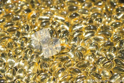 Image of Fish oil capsules spilled to make a background
