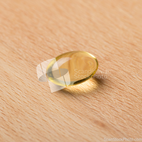 Image of Fish oil capsule laying on a table