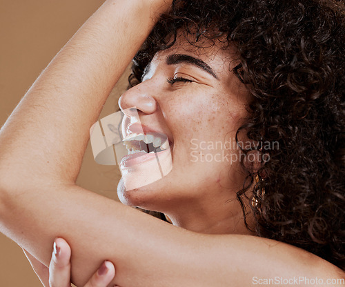 Image of Makeup, woman and skincare for wellness, natural beauty and fresh with brown studio background. Cosmetics, healthy female and girl with organic facial, smooth face, or smile with freckles and happy.