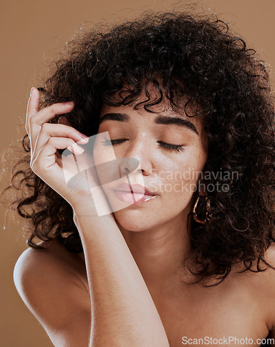 Image of Beauty, skincare and wellness by woman in studio for relax, zen and glamour makeup, pamper and treatment with mockup. Black woman, hair care and wellness girl model calm and satisfied with cosmetics