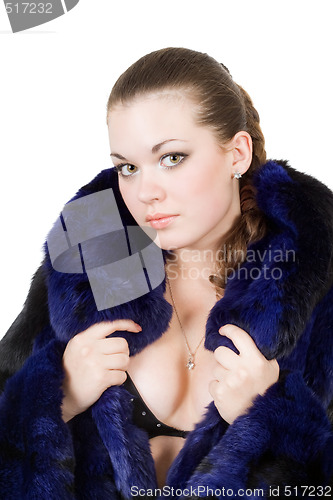 Image of The young beautiful woman in a fur coat