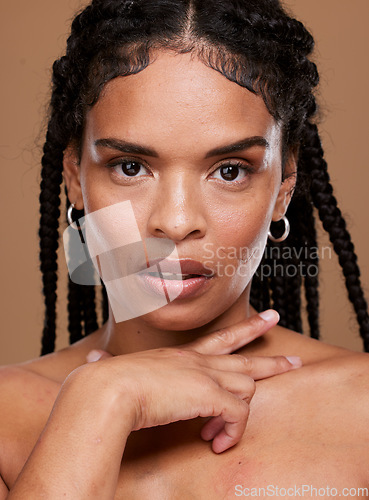 Image of Beauty, hair care and face of black woman in studio on brown background for fashion. Cosmetics, wellness and portrait of serious girl model for hair salon products for natural, healthy and long hair