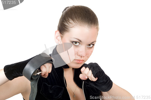 Image of Pretty young angry woman throwing a punch