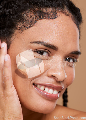 Image of Makeup, black woman and face with tone cream lines, skincare and smile on brown studio background. Cosmetics, African American girl and young female with healthy skin, contouring smears and portrait