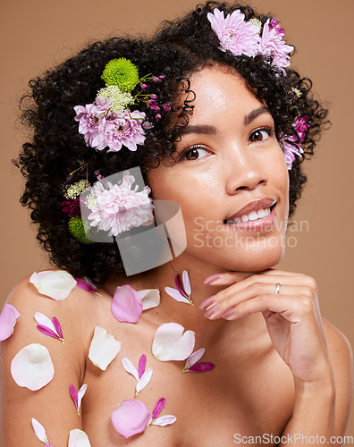 Image of Beauty, art and black woman with flowers in hair in portrait with studio background. Nature, luxury spa and woman with flower crown, natural skincare or hair care product with sustainable ingredients