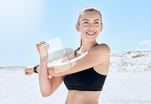 Image of Exercise woman, stretching arm and ocean fitness, freedom and wellness, sports and training in sunshine. Happy athlete workout, body warm up at sea and healthy lifestyle, motivation and summer energy