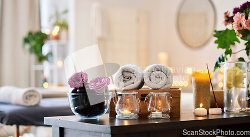 Image of Spa, luxury and wellness room at a resort for relax, peace and beauty massage for health and wellness. Empty, flowers and candles for rest, stress relief and healing at a zen calm center or salon.