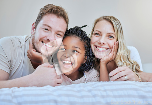 Image of Diversity, happy family or foster parents in bedroom relax, happy or family love portrait in house or home. Mother, father and black girl with smile on bed for happiness, quality time or support