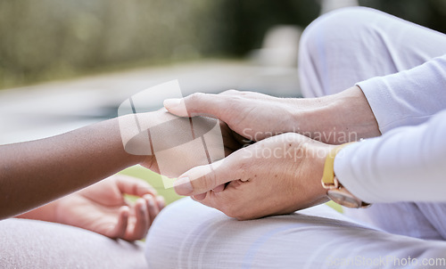 Image of Love, support and mother holding hands with child for trust, safety and hope for foster care or adoption. Hands, diversity and interracial family connect in hope, advice and peace while bonding