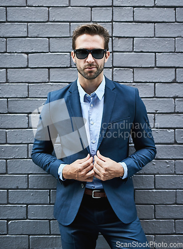 Image of Fashion, sunglasses and business man by brick wall in Canada for company success, professional goals or targets, mission or vision. Portrait, boss and happy ceo standing against street wall outdoors.