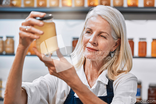 Image of Small business, elderly woman and honey store owner for raw, natural and organic product, proud and happy. Sustainable business, market and senior woman with glass jar of healthy, syrup and nutrition