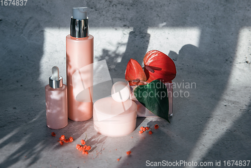 Image of Cosmetic bootles with flowers