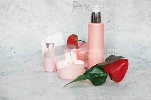 Image of Cosmetic bootles with flowers