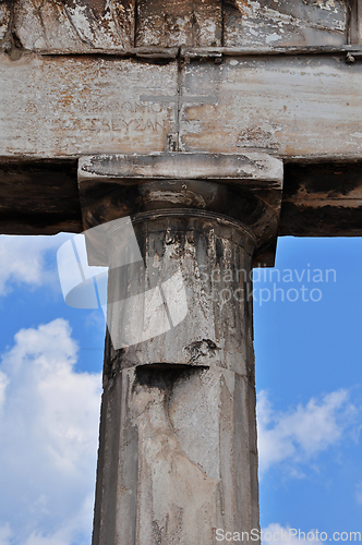 Image of doric column and faded inscription