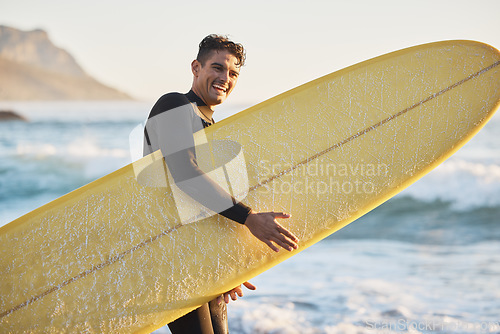 Image of Portrait, man and surfing board, beach and summer training, freedom and happiness outdoors in South Africa. Portrait of happy surfer guy, ocean and sea water, relax and happiness for nature adventure