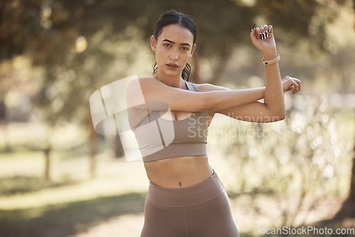 Image of Woman, park portrait and stretching for exercise, workout or running with smartwatch, outdoor and focus. Runner, warm up and wellness in summer sunshine for workout, fitness and training for health