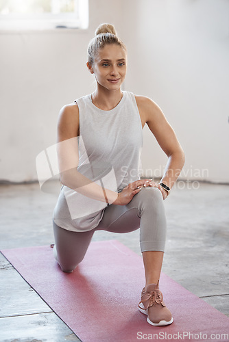 Image of Fitness, health and woman doing a stretching exercise before a workout at a wellness class in gym. Sports, healthy and girl doing a warm up for legs and body for workout or training at a sport studio