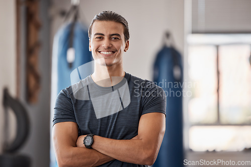 Image of Gym, fitness and portrait of proud man standing with smile, motivation, health and energy for training. Coach, personal trainer or happy boxing club owner in studio for workout, coaching and wellness