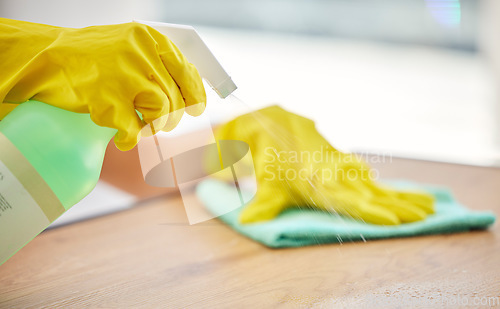 Image of Cleaning, spray and hands of woman with table furniture for healthcare, safety and bacteria. Dust, chemical and product with cleaner and cloth at home for disinfection, virus and germs protection