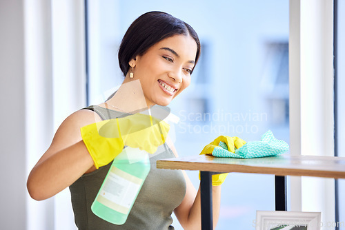 Image of Spray bottle, fabric cloth and cleaner cleaning wooden furniture with chemical bacteria disinfectant for home housekeeping. Dust cleaning service, hygiene product and black woman sanitize surface