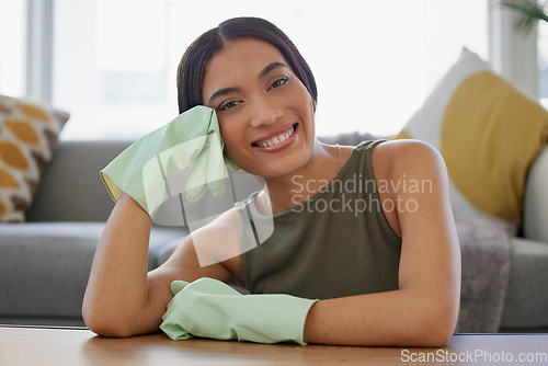 Image of Cleaner, gloves for cleaning and woman with hygiene and protection against bacteria, housekeeping and cleaning service. Portrait of housekeeper, home maintenance and clean in living room.