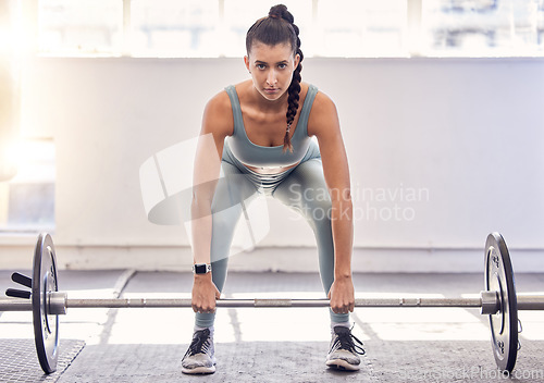 Image of Fitness, barbell weight and portrait of a woman doing a lifting exercise for strength, health and training. Sports, strong and healthy athlete doing a weightlifting workout with motivation in the gym