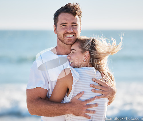 Image of Couple, hug and beach in summer while on vacation for love, care and support in a healthy marriage with happiness and trust. Portrait of a man and woman together by the sea for bonding and to relax