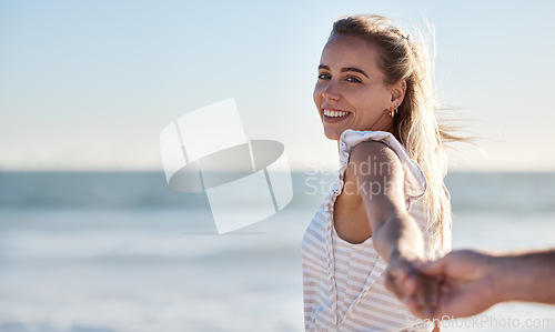 Image of Holding hands, smile and couple walking on beach with support, love and care on a holiday. Summer, affection and portrait of a woman with the hand of a man for trust, travel and adventure by the sea