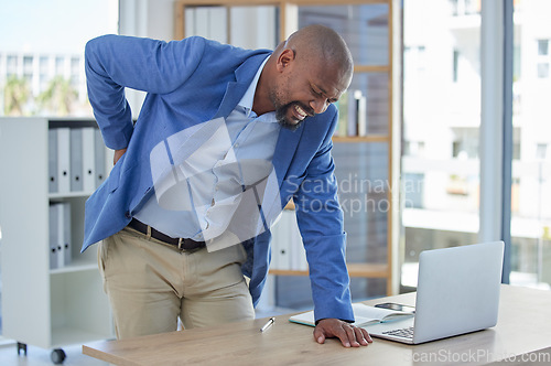 Image of Back pain, spine and injury with businessman at desk for burnout, muscle and fatigue. Overworked, stress and accident with black man and body ache for exhausted, tired and inflammation problem