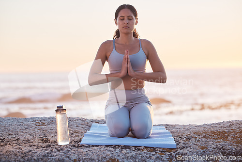 Image of Gen z woman, yoga and beach meditation, zen and fitness training, spiritual and prayer outdoor during sunset in nature. Calm female, mindfulness and healthy mindset for wellness at ocean in Hawaii