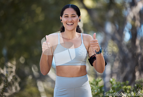 Image of Fitness, woman and thumbs up for exercise, nature or healthy workout run with smile in the outdoors. Portrait of happy female smiling showing thumbsup for good health training or running at the park